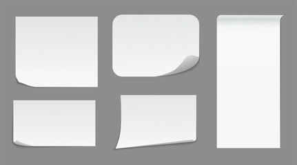 Collection of various white paper notes with curled corners.