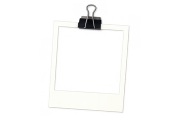 Blank instant camera film frame held by a binder clip, creating a vintage photo mockup with transparency