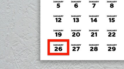 Close-up of the date January 26th marked with a red cursor on the wall calendar 2026
