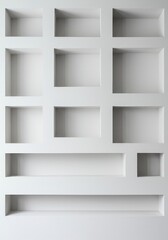 Clean architectural detail showing a white wall with multiple built-in rectangular niches. Modern design element for storage or display purposes ,built-in ,architecture ,apartment