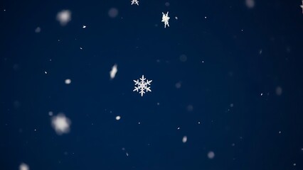 Naklejka premium Snowflakes falling on dark blue background falling snow winter 1