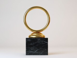 Golden ring sculpture on black marble base against white backdrop