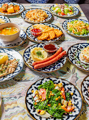 Fototapeta premium Delicious spread of various foods brings friends together in a joyful celebration of flavors