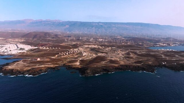 Coastal view of Tenerife with leprosarium ruins and windmills