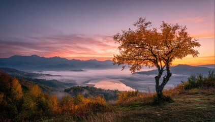 Autumn sunrise over misty mountains