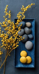 Zen stones and flowers on tray
