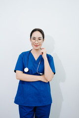 Confident Asian nurse in blue scrubs with stethoscope. Professional healthcare worker portrait for hospital, clinic, medical service, wellness