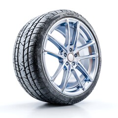 Obraz premium A modern car tire with intricate silver alloy rim design stands against a clean white backdrop emphasizing its durable tread pattern and sleek style.