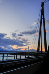 Fototapeta premium bridge over the sea with mountain landscape 
