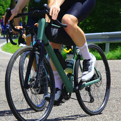 Fototapeta premium cycling race with cyclists pedaling vigorously and energetically on high-performance racing bikes