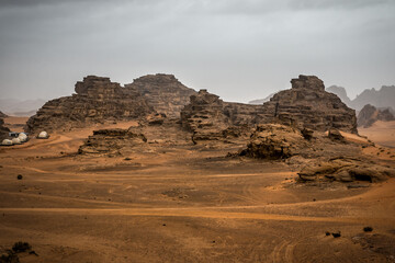 Martian landscape. Red rocky mountain in Wadi Rum desert under rainy sky