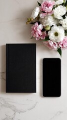 Obraz premium Black notebook and a smartphone lie beside a pink and white flower bouquet on a marble surface. Concept Notebook and smartphone, Pink and white bouquet, Marble surface, Desk still life