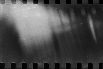 Naklejka premium Old film texture with scratches, noise and light leaks. Realistic overlay film texture in black-white, dust and grain. Distressed retro movie or photo negative effect of cinema nostalgia.