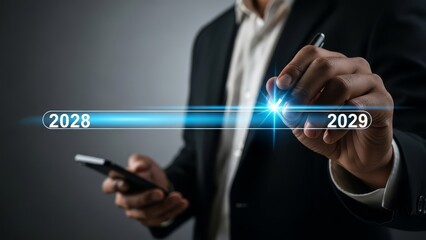 Businessman drawing a timeline connecting the years 2028 and 2029 on a virtual interface.
