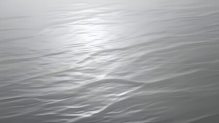 Serene black and white ocean waves.