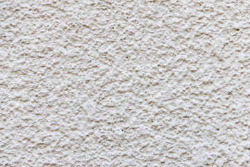 凹凸のある白いリシン吹き付けの外壁テクスチャ