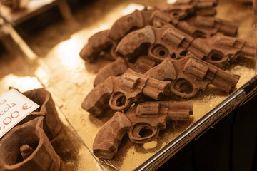Chocolate revolver guns creating a unique sweet candy display