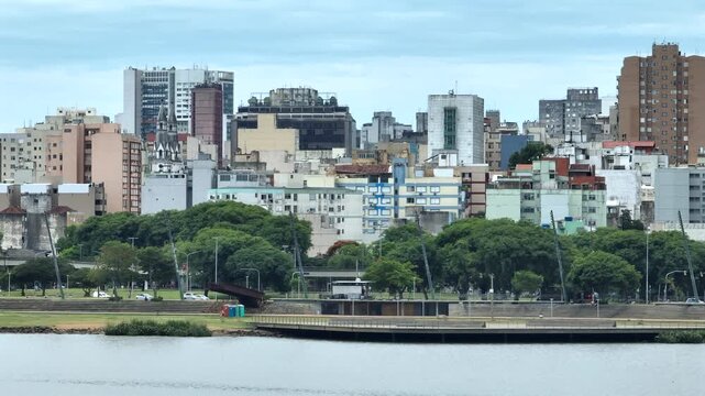 Porto Alegre downtown cityscape and urban architecture captured in aerial 7x telephoto view with right to left pan. Features dense buildings and skyline. Recorded in 4K professional video.