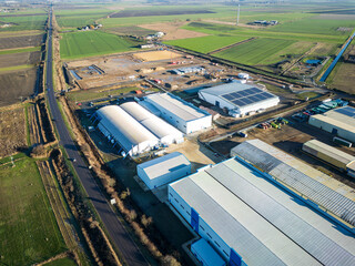 Interesting UAV view of modern industrial buildings seen on the outskirts of the town of Chatteris, Cambridgeshire, UK. The industrial zone is a large employer to the market town. © Nick Beer