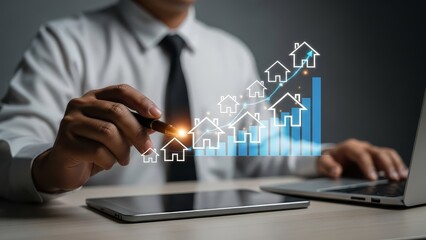 Businessman analyzing real estate market trends on a digital tablet and laptop