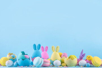 Cute and bright pastel colored Easter eggs and bunny background