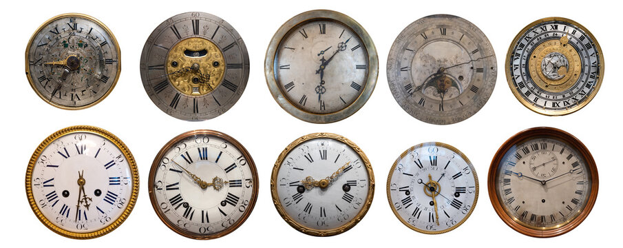 Collection of antique clock dials isolated on a white background, featuring engraved numerals, decorative details, and aged surfaces, representing old horology and classic craftsmanship.