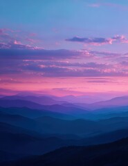 Majestic Layered Mountains Bathed in Vivid Pink and Purple Sunset Hues.