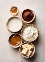 Baking ingredients arranged on a light beige surface