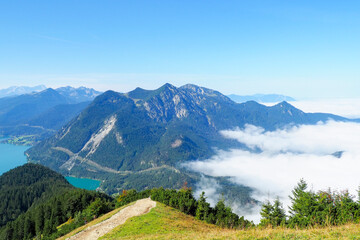 Obraz premium Walchensee, often called the “Caribbean of Bavaria,” known for its striking turquoise water and dramatic alpine setting. Surrounded by steep mountain slopes and open alpine meadows