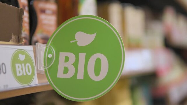A "Bio" sign on a shelf in an aisle in a supermarket - closeup