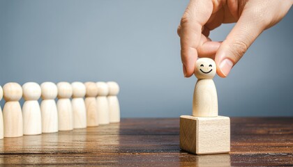 Hand Picking a Wooden Figure.