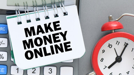 MAKE MONEY ONLINE lettering written on notepad. Business concept.