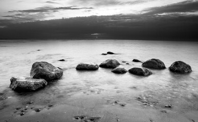 Stones on the beach. Black and white photography.
