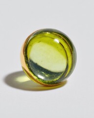A round, lime-green glass ring