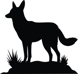 Elegant black silhouette of a wild canine animal standing gracefully on a small grassy mound