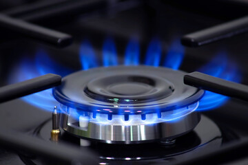 Gas is burning on the stove. Close up. Gas supply problems. Gas crisis. Heat in homes.