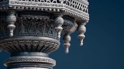 Intricate silver filigree pillars with ornate decorative frame against deep navy background showcasing elegance and timeless craftsmanship