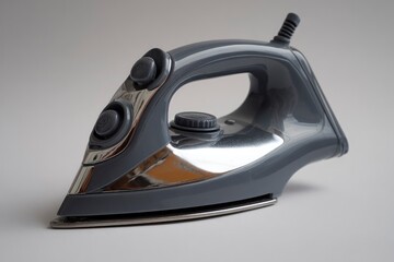A sleek, modern electric steam iron with a dark gray body and polished chrome accents is prominently displayed against a clean, neutral background. The appliance features visible controls and a sturdy
