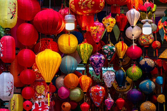 H&agrave;ng M&atilde; Street, Hanoi comes alive with Lunar New Year decorations for the Year of the Horse, featuring traditional red and gold ornaments symbolizing luck, prosperity, and celebration. 