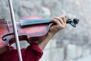 Close-up shot of the hand playing the violin.