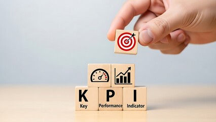 A hand placing a target block on top of KPI blocks
