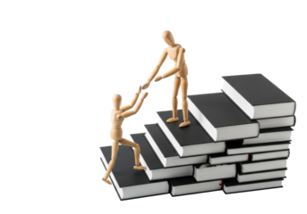 Polished wooden artist mannequins, one assists another climbing black books with white edges in bright white studio, copy space. Concept of educational guidance and progress