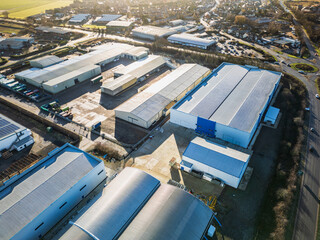 Interesting drone UAV view of a modern industrial and technology zone in the English market town of Chatteris, UK. In the distance is the market town, supermarket and many private homes.  © Nick Beer