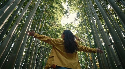 Sustainable eco-friendly travel tourist Person standing in a bamboo forest, arms outstretched, embracing nature's tranquility.