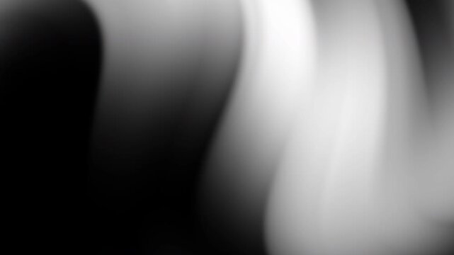 Black and white blurred waves of light and shadow, ideal for background designs, modern art projects, and minimalist concepts.