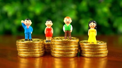Miniature people on gold coin stacks symbolize financial success against a lush green backdrop. The image highlights growth, investment, and economic achievement.