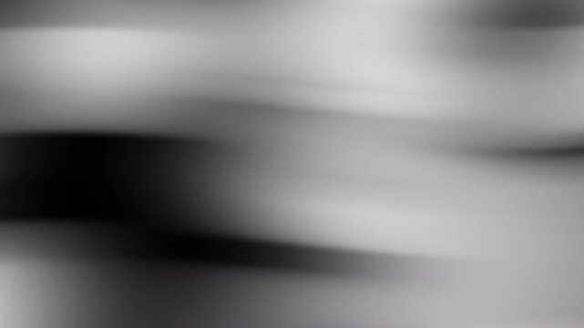 Abstract blurred background with a black white gradient suitable for contemporary design projects, website backgrounds, or minimalist artworks.