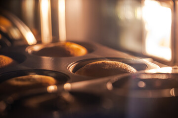 The golden pound cake is rising in the oven.