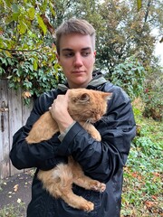 young man with cat