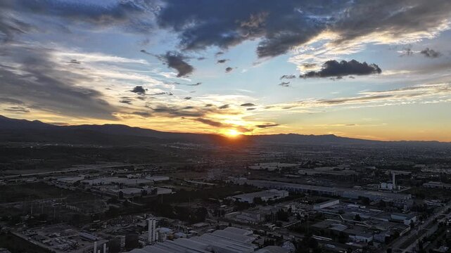 Time-lapse taken over the city with a drone at sunset
